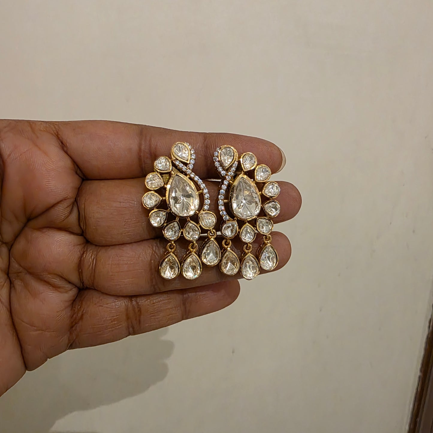 Peacock motif polki studs with polki drops