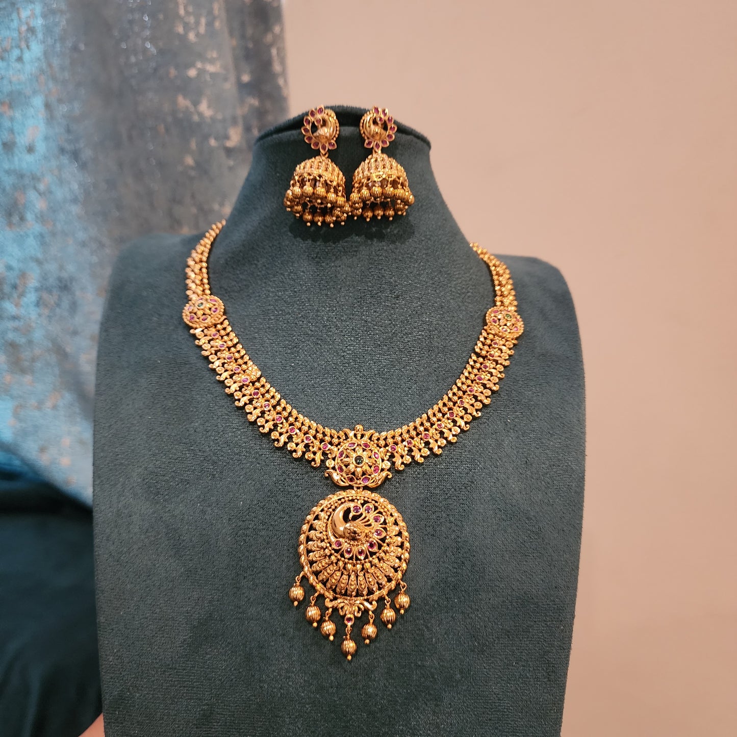 Solid gold replica neckset design with peacock motifs