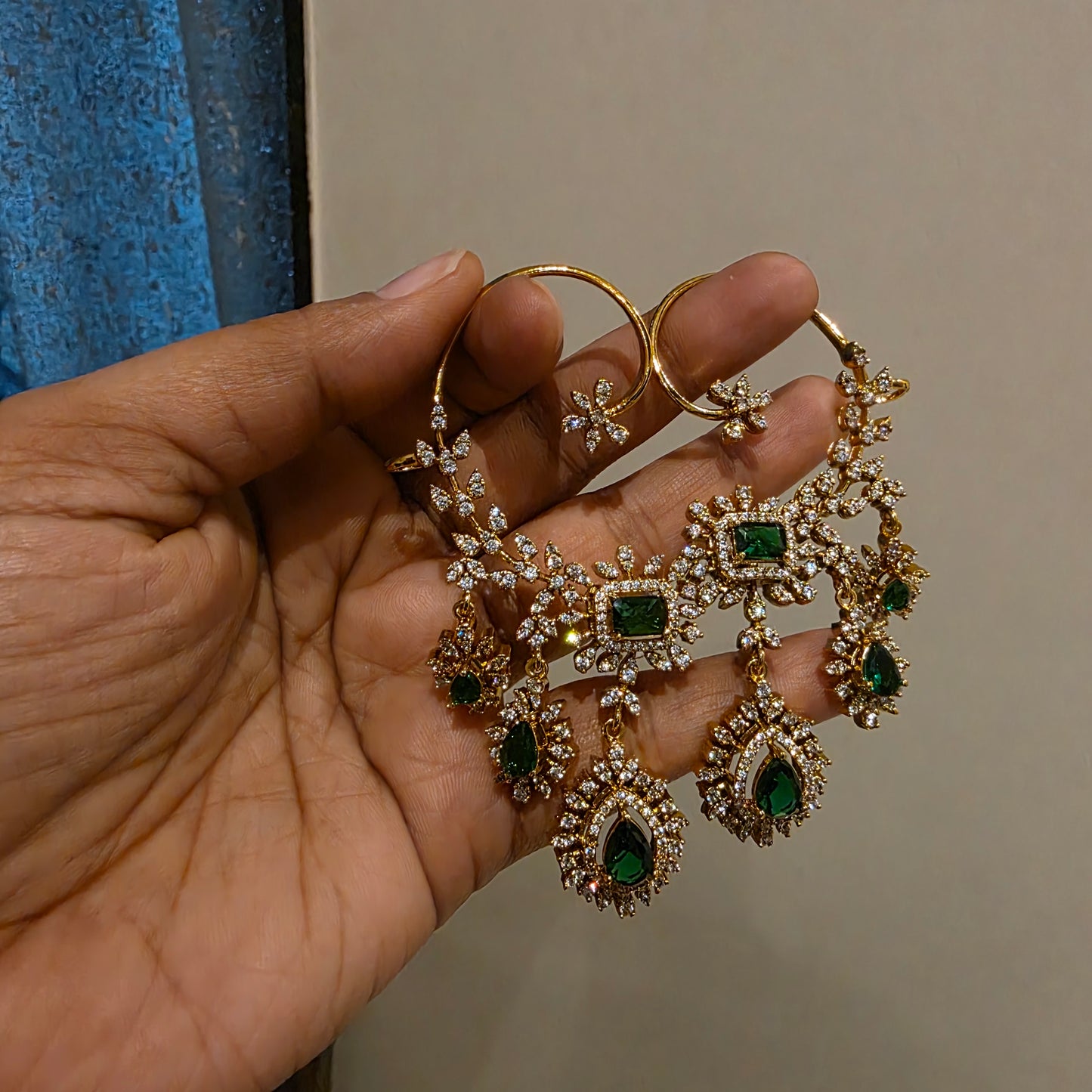 Rachana- ad and emarald green stone earcuffs