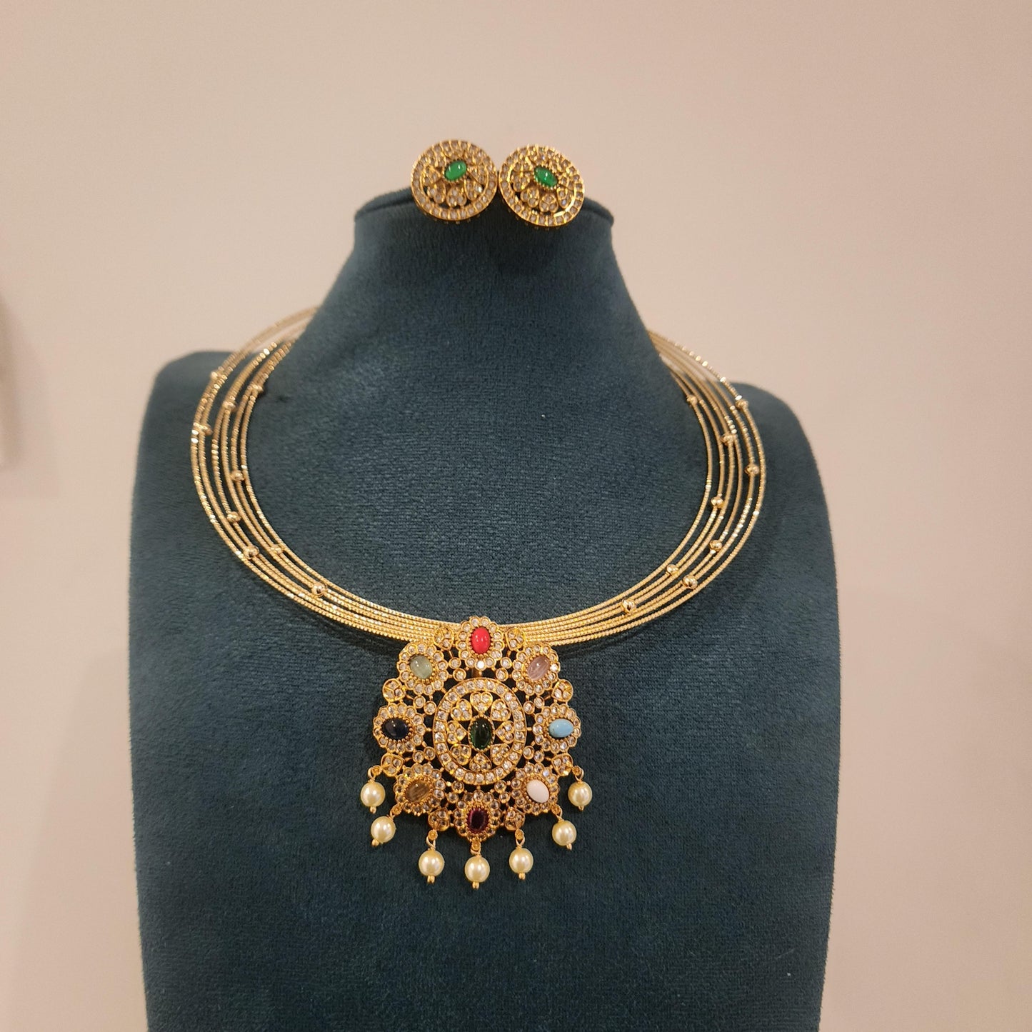 Layered hasli with navaratan pendant