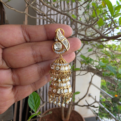 Moissanite polki double layered jumkha with peacock motif.