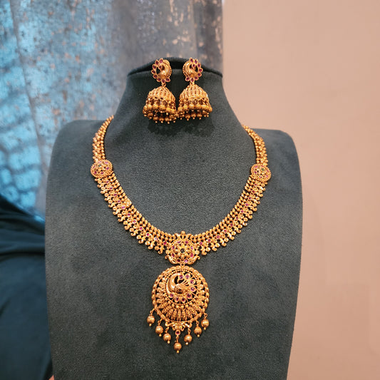 Solid gold replica neckset design with peacock motifs