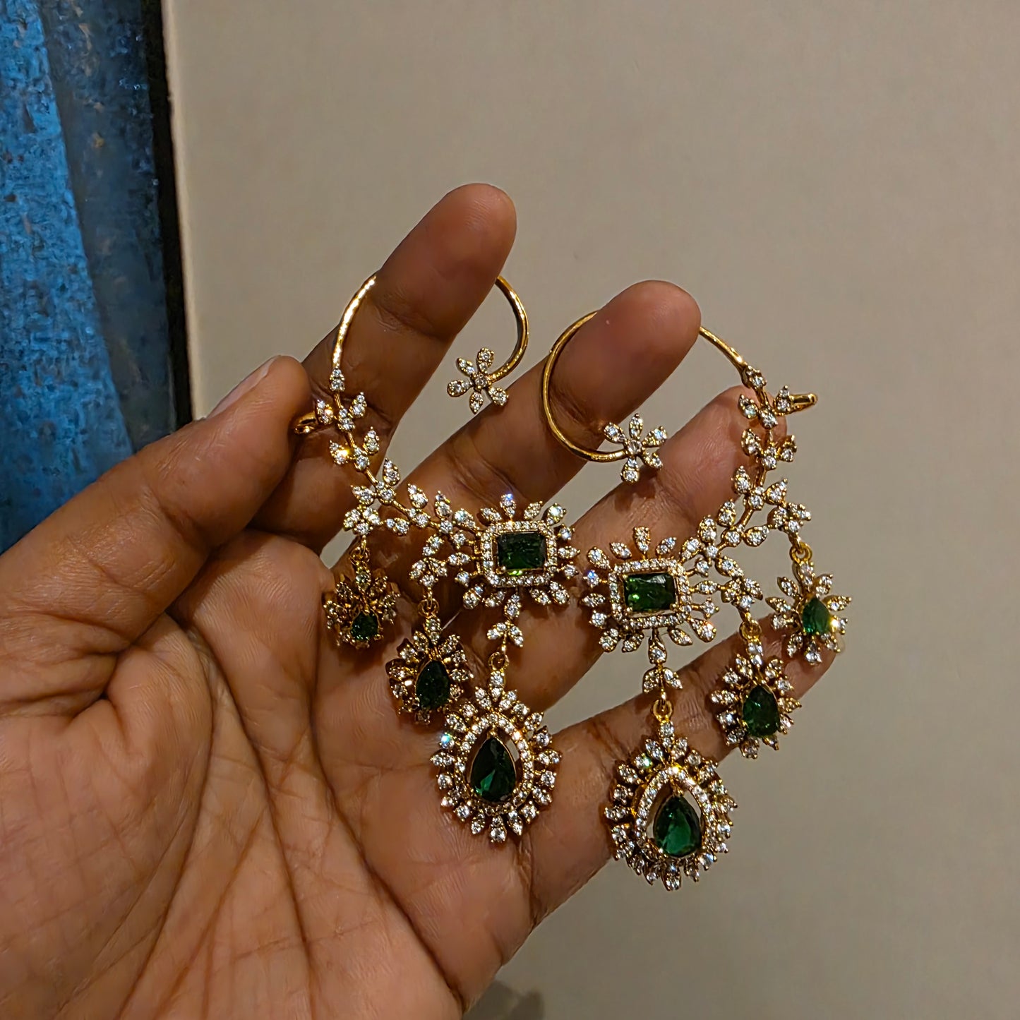 Rachana- ad and emarald green stone earcuffs