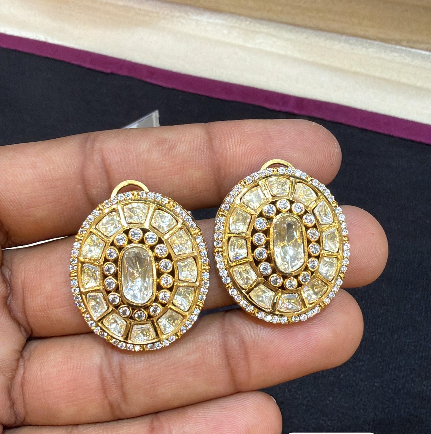 Oval shaped polki studs in white